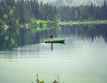 Flyfisher in a boat.