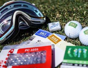 Ski mask, golf balls, pamphlets for ski and golf.