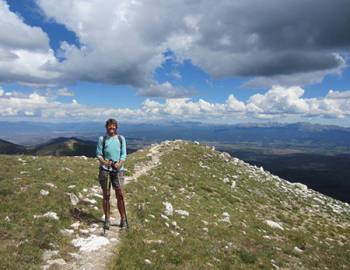 Hiker on a hilltop trail.