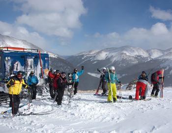 Skiers on top of a mountain.