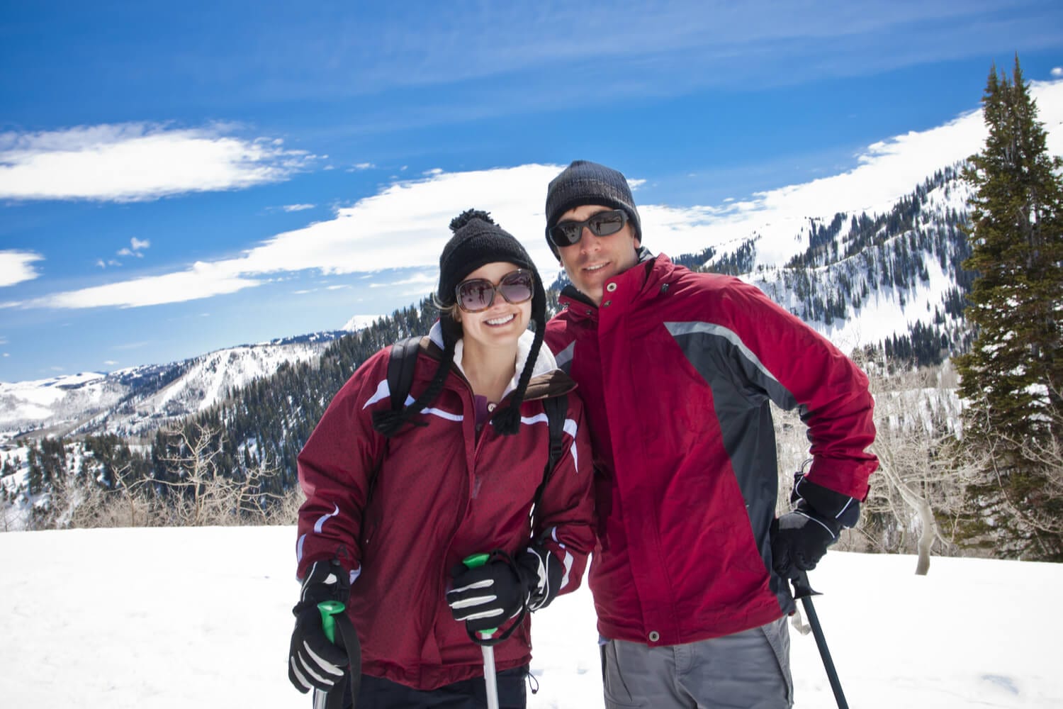 A outdoor enthusiast couple happily avoids crowds while skiing in Colorado.